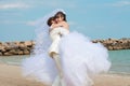 Young and beautiful bride and groom on the beach Royalty Free Stock Photo