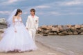 Young and beautiful bride and groom on the beach Royalty Free Stock Photo