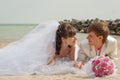 Young and beautiful bride and groom on the beach Royalty Free Stock Photo