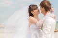 Young and beautiful bride and groom on the beach Royalty Free Stock Photo