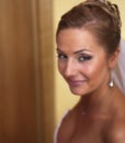 Young beautiful bride looking with smile at camera