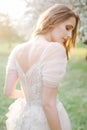 Young beautiful bride portrait in park with flowers Royalty Free Stock Photo
