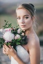 Beautiful bride with wedding bouquet