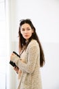 Young woman with beige knitted cotton long cardigan Royalty Free Stock Photo