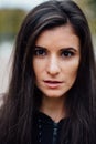 Young beautiful brunette fitness woman looking at camera and smiling, closeup. Royalty Free Stock Photo