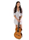 Young beautiful brunette girl with acoustic guitar Royalty Free Stock Photo