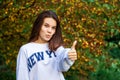 Young beautiful brunette girl, autumn park outdoors Royalty Free Stock Photo