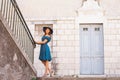 Young and beautiful brunette girl in dress and hat walking outdoor in the Old Town. Nice, France. Summer vacation Royalty Free Stock Photo