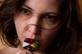 Young beautiful brunette girl with the gemstone in her mouth Royalty Free Stock Photo