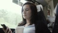 Young Beautiful Brunette Girl Travelling By Train, Looking Out The Window And Using Her Smartphone, Travelling Concept