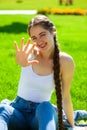 Young beautiful brunette girl in white shirt posing on spring park Royalty Free Stock Photo