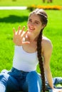 Young beautiful brunette girl in white shirt posing on spring park Royalty Free Stock Photo