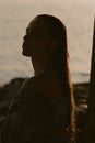 Young beautiful brunette on the lake with wet hair and light makeup Royalty Free Stock Photo