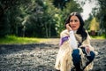 Young beautiful brunette speaking on the phone at winter beach Royalty Free Stock Photo