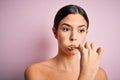 Young beautiful brunette woman brushing her teeth using tooth brush and oral paste, cleaning teeth and tongue as healthy health Royalty Free Stock Photo