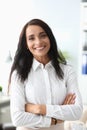 Young beautiful brunette woman in business suit smiling at office portrait Royalty Free Stock Photo