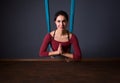 Young beautiful brunette woman doing fly yoga. Sitting in hammoc