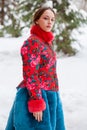 Young beautiful brunette woman in fur coat posing on winter park Royalty Free Stock Photo