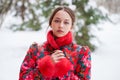 Young beautiful brunette woman in fur coat posing on winter park Royalty Free Stock Photo