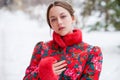 Young beautiful brunette woman in fur coat posing on winter park Royalty Free Stock Photo