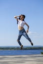 Young beautiful brunette woman posing against blue sky bright sunny weather Royalty Free Stock Photo