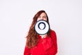 Young beautiful brunette woman screaming using megaphone over isolated white background Royalty Free Stock Photo