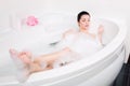 Beautiful young woman takes bubble bath Royalty Free Stock Photo
