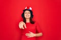 Young beautiful brunette woman wearing united states hat celebrating independence day laughing at you, pointing finger to the