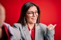 Young beautiful business woman with blue eyes wearing glasses making selfie by camera pointing and showing with thumb up to the Royalty Free Stock Photo