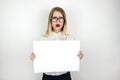 Young beautiful business woman in eyeglasses holding blank sheet of paper isolated white background space for text Royalty Free Stock Photo