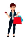 Young beautiful business woman holding credit card and shopping bags Royalty Free Stock Photo