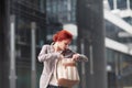 Young beautiful business woman holding purse Royalty Free Stock Photo