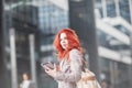 Young beautiful business woman holding tablet, working in downtown, outdoors Royalty Free Stock Photo