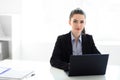 Young beautiful business woman with laptop in the office Royalty Free Stock Photo