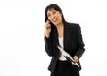 Portrait of a young business woman talking on phone holding a folder Royalty Free Stock Photo