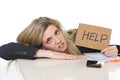 Young beautiful business woman suffering stress working leaning sad on office desk asking for help Royalty Free Stock Photo