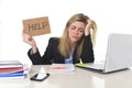 Young beautiful business woman suffering stress working at office asking for help feeling tired Royalty Free Stock Photo