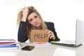 Young beautiful business woman suffering stress working at office asking for help feeling tired Royalty Free Stock Photo