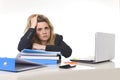 Young beautiful business woman suffering stress working at office computer desk load of paperwork Royalty Free Stock Photo