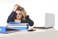 Young beautiful business woman suffering stress working at office computer desk load of paperwork Royalty Free Stock Photo