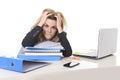 Young beautiful business woman suffering stress working at office computer desk load of paperwork Royalty Free Stock Photo