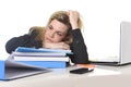 Young beautiful business woman suffering stress working at office computer desk load of paperwork Royalty Free Stock Photo