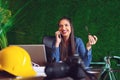 Young beautiful business woman talking on the phone and working on table in a modern office - Image Royalty Free Stock Photo