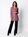 Young beautiful business woman walking in new design casual spring purple suit on grey Royalty Free Stock Photo