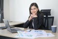 Young beautiful business woman working on laptop with documents in modern office Royalty Free Stock Photo