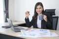 Young beautiful business woman working on laptop with documents in modern office Royalty Free Stock Photo