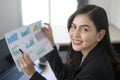 Young beautiful business woman working on laptop with documents in modern office Royalty Free Stock Photo