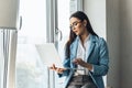 Young beautiful businesswoman in glasses working on laptop Royalty Free Stock Photo