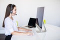 Young beautiful businesswoman with headset call center operator in office Royalty Free Stock Photo