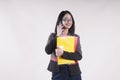 Young beautiful businesswoman with phone smiling braces red and yellow folder glasses